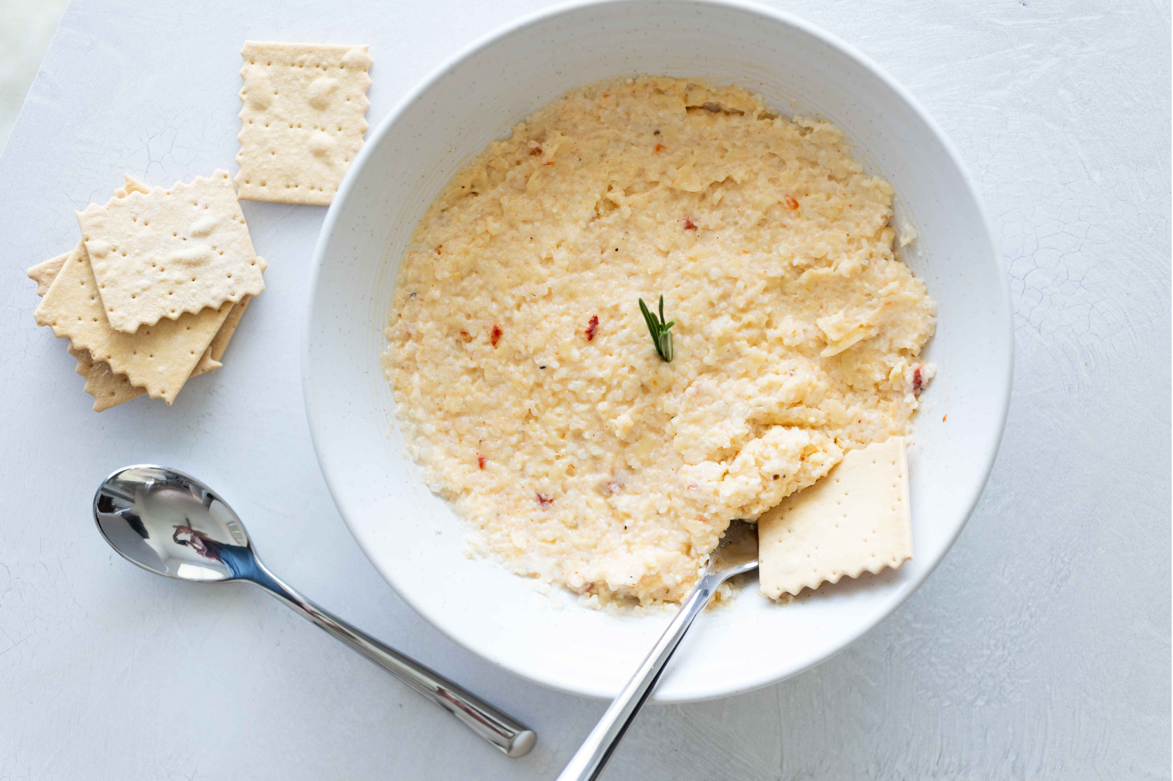 Pimento Cheese grits on a table. 