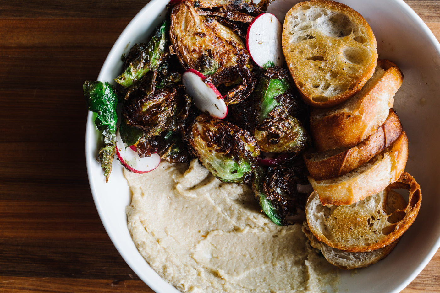Flash friend brussel sprouts with homemade hummus and crostini's. 