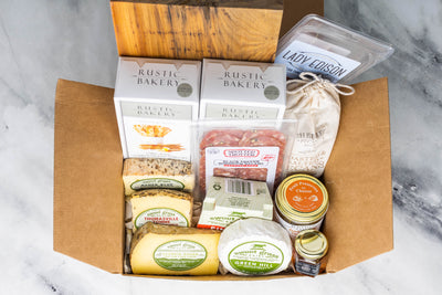 Cheese, Salami, Pecans, Prosciutto, Honey, Jam, Crackers in a gift box ready to purchase.