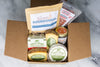 Cheese, Crackers, Salami, and Jam placed in a gift box.