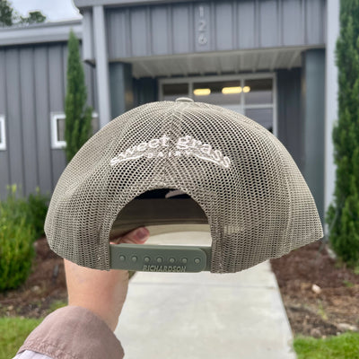 Back of Richardson hat with the Sweet Grass Dairy logo